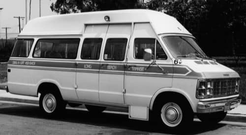Black and white picture of the original dial-a-lift minivan from 1975